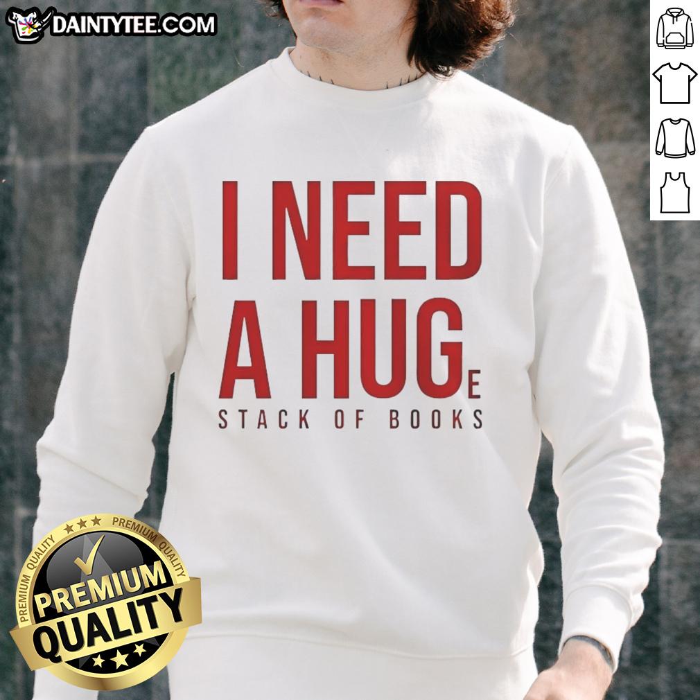Cozy 'Awesome I Need A Huge Stack Of Books' sweatshirt displayed on a wooden table with scattered books around it.