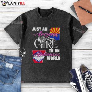 Alt Text: Awesome Arizona girl in an Arkansas world wearing a washed t-shirt, showcasing style and comfort in a vibrant setting.