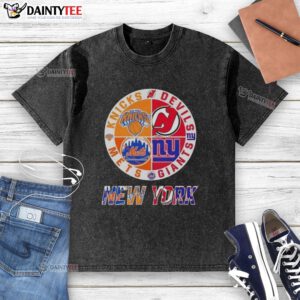 Alt Text: Awesome New York City sports logos on a washed t-shirt featuring Knicks, Devils, Giants, and Mets designs.