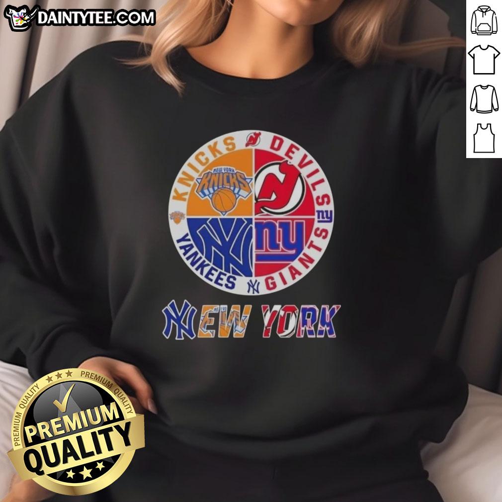 Alt Text: Awesome New York City sports sweatshirt featuring Knicks, Devils, Giants, and Yankees logos in a stylish design.