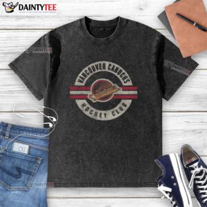 Alt Text: Vintage Vancouver Canucks washed t-shirt featuring a classic team logo, perfect for fans and casual wear.