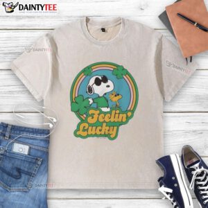 Alt Text: Cute Peanuts Shamrock Feeling Lucky washed t-shirt featuring Charlie Brown and Snoopy in festive green design.