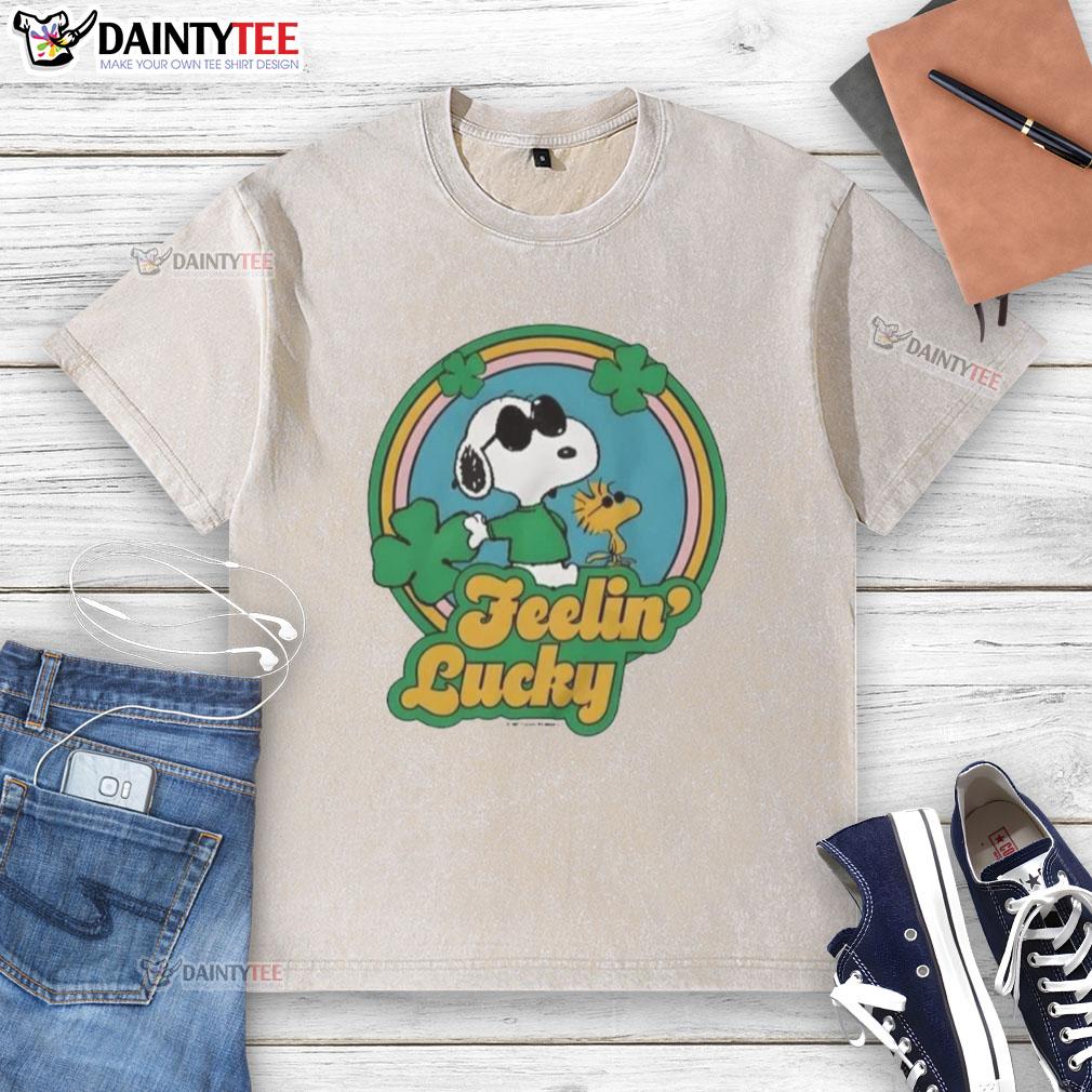 Alt Text: Cute Peanuts Shamrock Feeling Lucky washed t-shirt featuring Charlie Brown and Snoopy in festive green design.