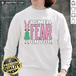 Louise from Bob's Burgers wearing 'I Smell Fear On You' sweatshirt, perfect for fans of the show and cozy style.