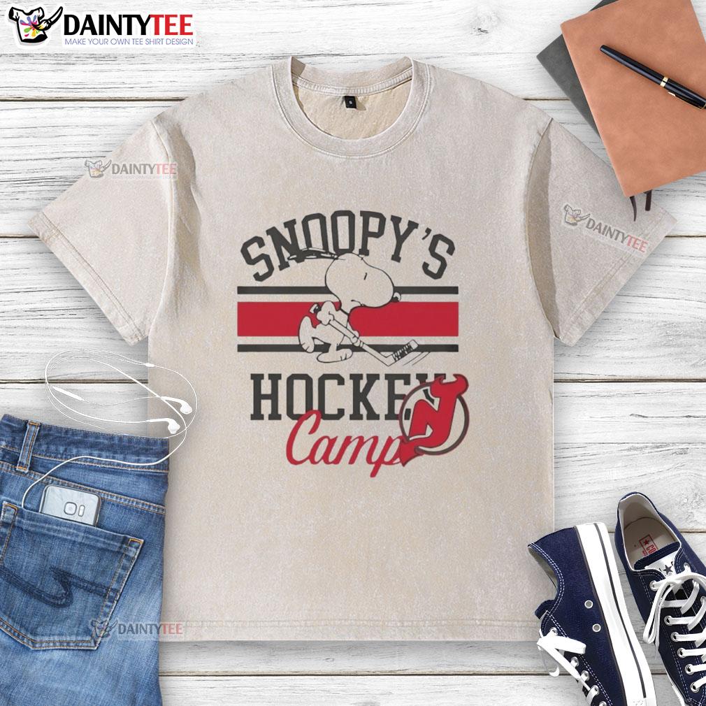 2026 New Jersey Devils Snoopy's Hockey Camps washed t-shirt featuring vibrant team colors and playful Snoopy graphic.