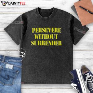 Good Persevere Without Surrender washed t-shirt displayed on a wooden surface, showcasing its unique design and soft fabric.