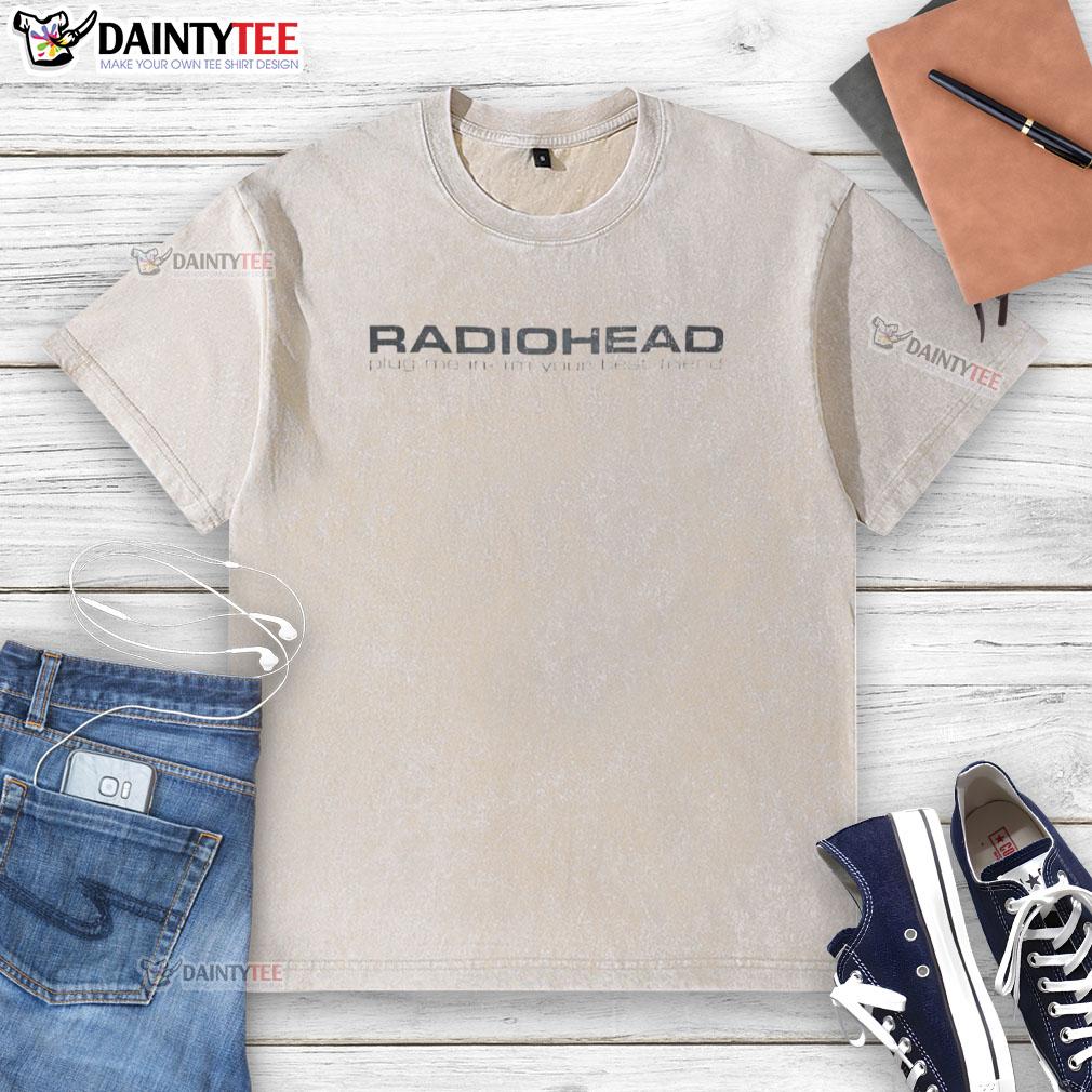 Alt Text: Vintage Good Radiohead Plug Me In I'm Your Best Friend washed t-shirt displayed on a wooden background.