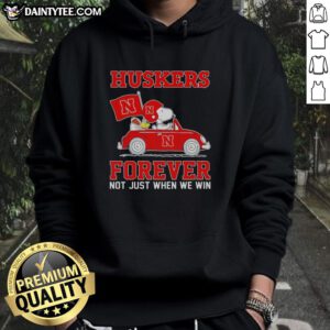 Alt Text: Hot Snoopy and Woodstock driving a car while wearing Nebraska Huskers hoodie, showcasing team spirit and fun.
