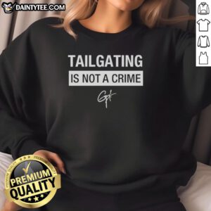 Alt Text: Cozy Hot Tailgating Is Not A Crime sweatshirt in vibrant colors, perfect for game day and outdoor gatherings.