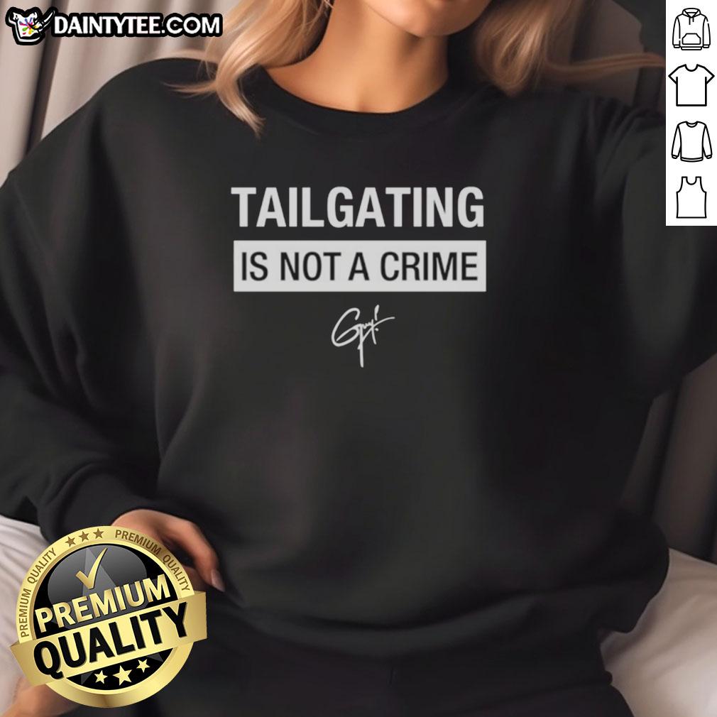 Alt Text: Cozy Hot Tailgating Is Not A Crime sweatshirt in vibrant colors, perfect for game day and outdoor gatherings.