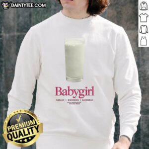 Adorable baby girl wearing a Nice sweatshirt featuring Kidman, Dickinson, and Banderas designs, smiling happily.