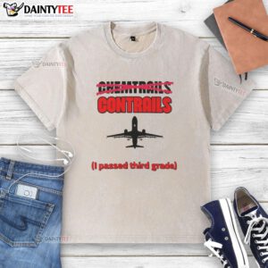 Airplane silhouette on a washed t-shirt featuring nice chemtrails and contrails, perfect for third-grade learners.
