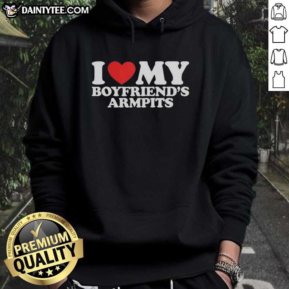 Girl wearing a red heart hoodie that says 'I Love My Boyfriend's Armpits' while smiling outdoors.
