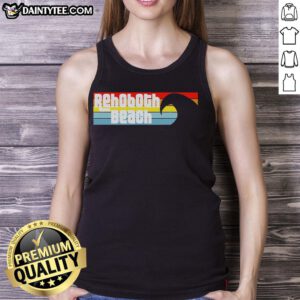 Woman wearing a 'Nice I Love Rehoboth Beach Delaware' tank top by the Atlantic Ocean, showcasing beach vibes.