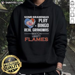 Real grandmas play bingo in Liberty Flames hoodie, showcasing fun and community spirit at the game.