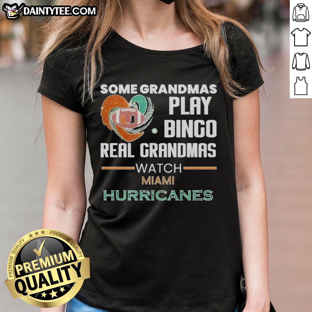 Grandmas enjoying bingo while wearing Miami Hurricanes ladies tee, showcasing fun and team spirit for fans.