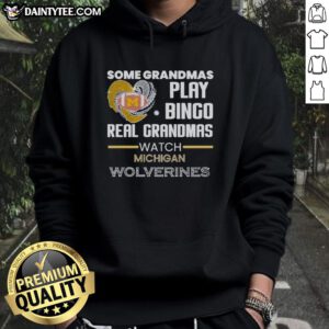 Grandmas in Michigan Wolverines hoodies play bingo, showcasing fun and team spirit in a cozy setting.