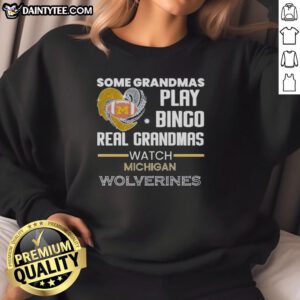 Real grandmas enjoying bingo while wearing Michigan Wolverines sweatshirt, showcasing fun and team spirit.