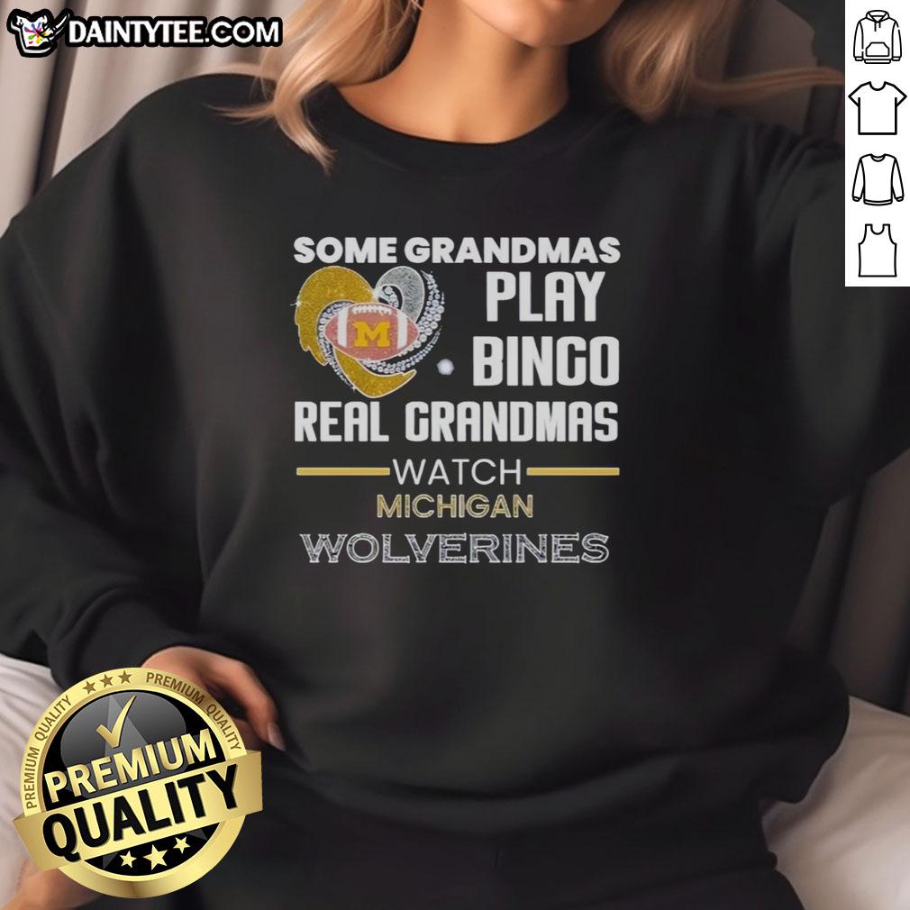 Real grandmas enjoying bingo while wearing Michigan Wolverines sweatshirt, showcasing fun and team spirit.
