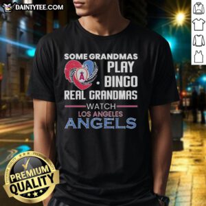 Grandmas watch Los Angeles Angels game wearing heart-shaped bingo T-shirt, showcasing team spirit and fun.