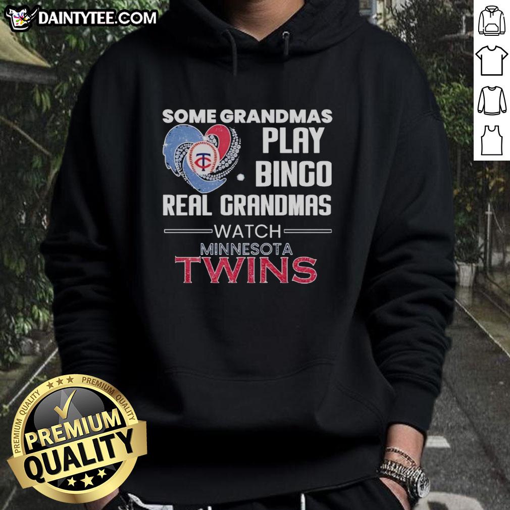 Grandmas enjoying Bingo at a Minnesota Twins game in a heart-shaped hoodie, celebrating a fun day at the ballpark.