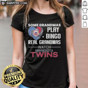 Grandmas enjoying bingo at a Minnesota Twins game, wearing a heart-shaped tee celebrating real grandmas' love for baseball.
