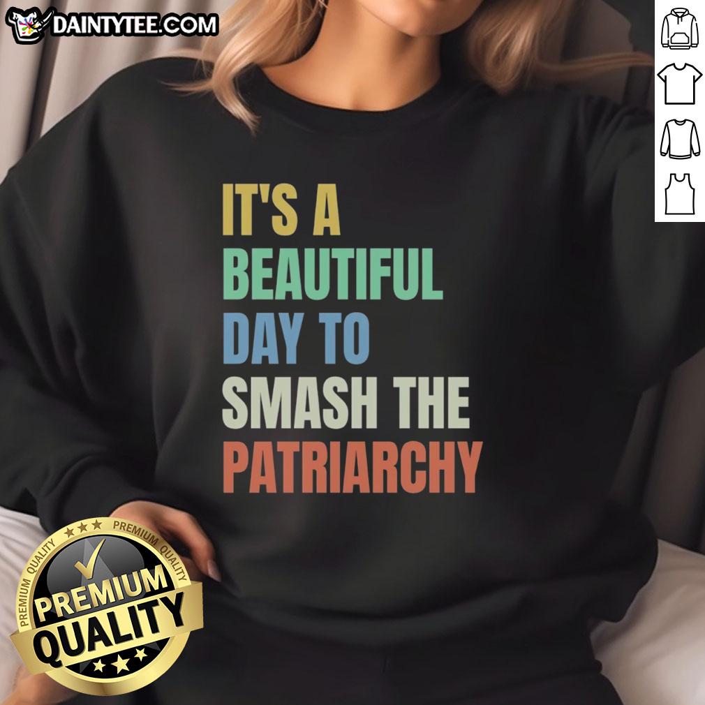 Alt Text: Colorful rainbow sweatshirt with 'It's a Beautiful Day to Destroy the Patriarchy' text, perfect for feminist activism.