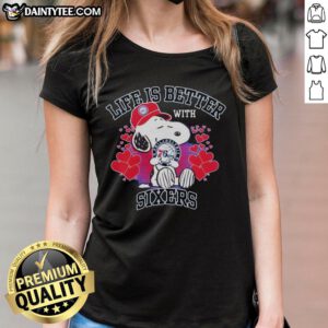 Snoopy holding Philadelphia 76ers logo on a ladies tee, showcasing 'Life Is Better With Sixers' design.