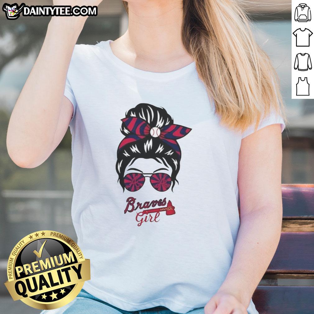 Atlanta Braves girl in a messy bun and glasses wearing a stylish ladies tee, showcasing team spirit and casual style.