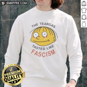 Alt Text: Nice The Teargas Tastes Like Fascism sweatshirt featuring bold text design, perfect for expressing anti-fascist sentiment.