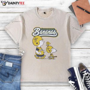 Alt Text: Original Peanuts characters and Savannah Bananas graphic on a washed t-shirt, perfect for casual wear.