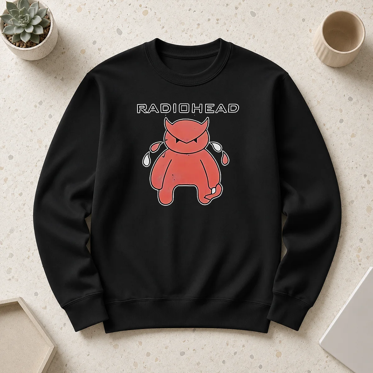 Funny Radiohead Distressed Crying Devil Character Sweater featuring a unique distressed devil graphic on a cozy crewneck sweatshirt