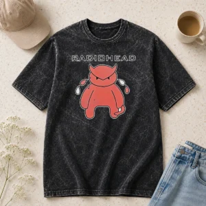 Funny Radiohead Distressed Crying Devil Character printed on a soft washed t shirt in faded black