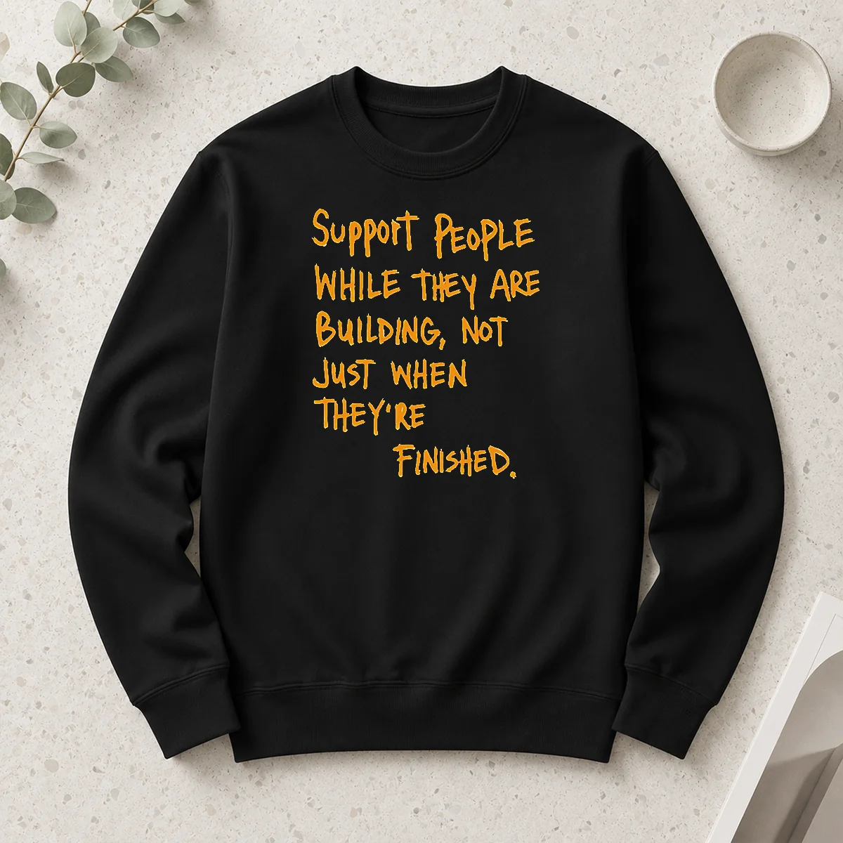 Hot Support People While They Are Building Not Just When They Are Finished Text printed on a black long sleeve shirt