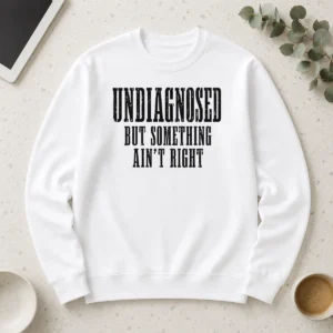 Top Undiagnosed But Something Ain't Right Chronic Illness long sleeve shirt in black, front view with clear text design